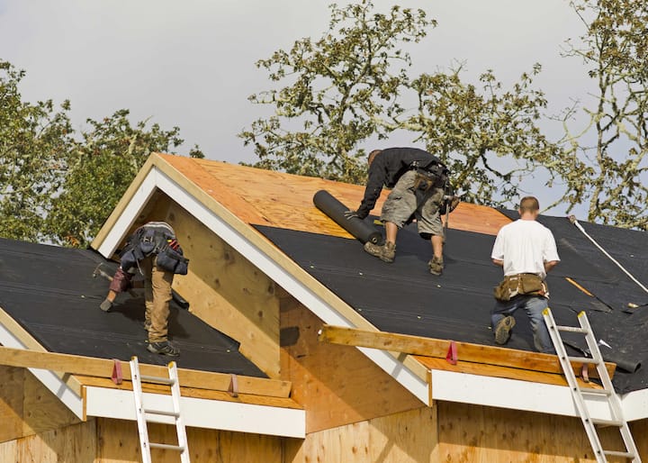 alice roofing repair experts working on a residential home.